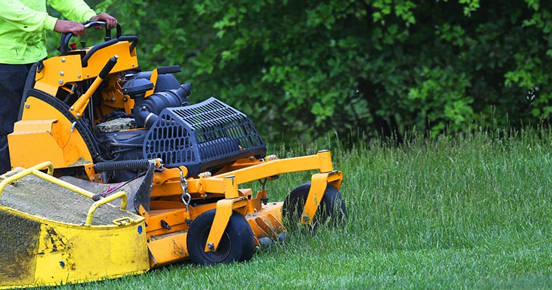 Landscaper Mowing