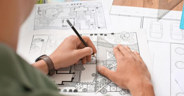 man-drawing-on-landscape-design
